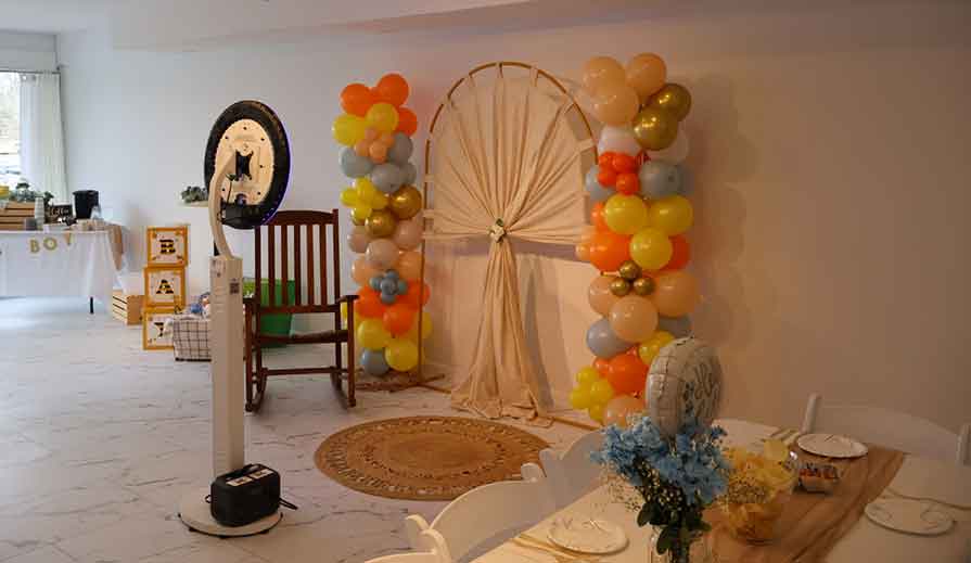Open-air digital photobooth with backdrop and props